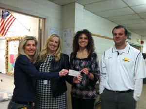 Waynesville Middle School seventh grade science department sponsored a school-wide fundraiser to bring awareness to genetic disorders.  Jeans for Genes and Hats for Hope gave the students and faculty an opportunity to donate money.  Students, faculty and staff gave a total of $318 to the Fragile X Research Foundation.  The funds were presented to Jennifer Kelly, a fellow teacher and mother of a son with Fragile X syndrome.  Pictured are Patrice McCoy, Jennifer Kelly, Amy Tiller, and Cam Bass.  